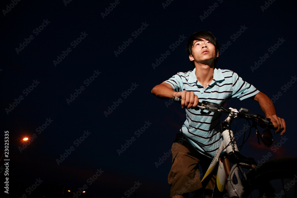 young asian man with bike young asian man with bike