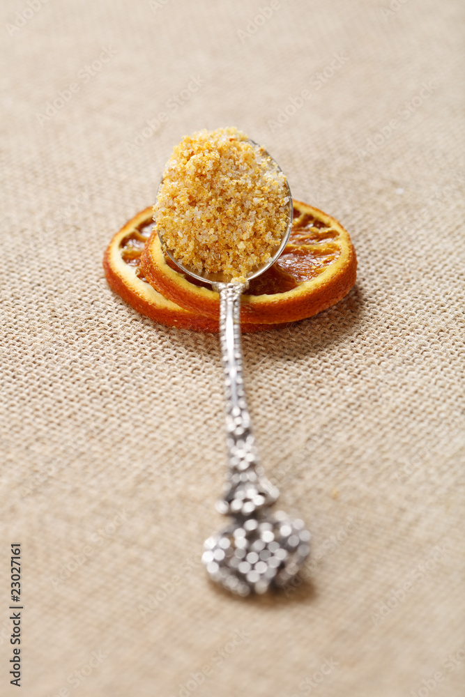 sea salt with dried orange in spoon on hessian backdrop sea salt with dried orange in spoon on hessian backdrop