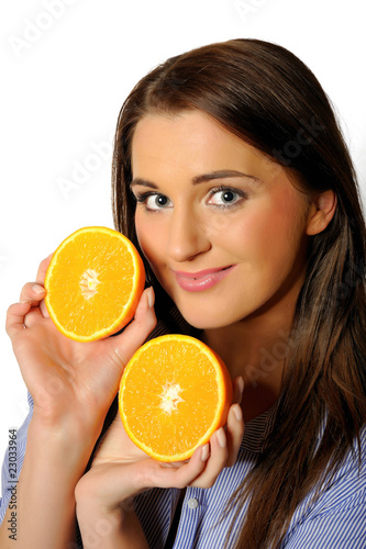 young beautiful woman with citrus orange fruit having fun