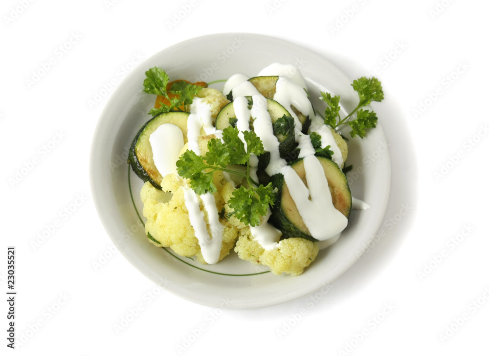 Stewed vegetables with sour cream in a bowl Stewed vegetables with sour cream in a bowl