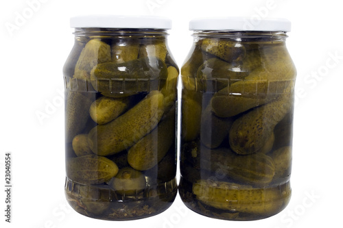 two jars of pickled cucumbers isolated on a white background