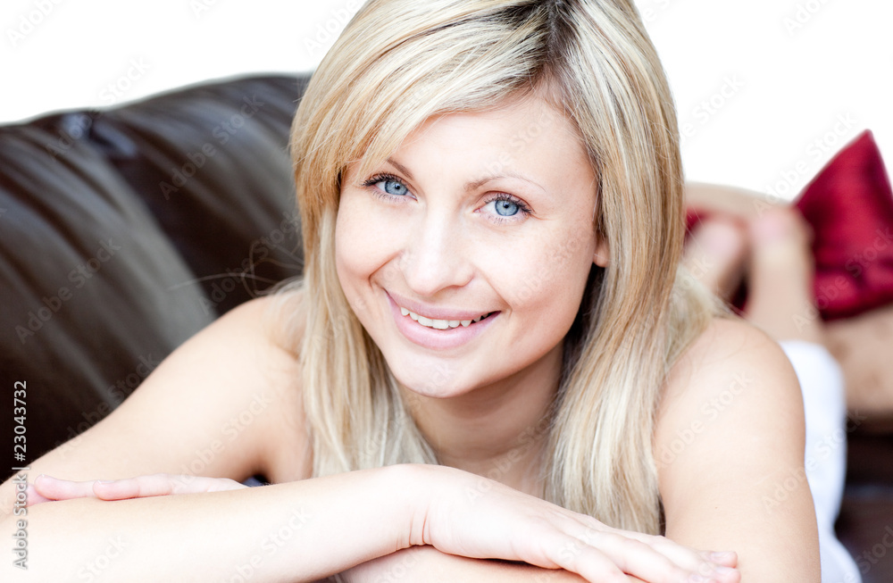 Portrait of a smiling woman lying on the sofa Portrait of a smiling woman lying on the sofa