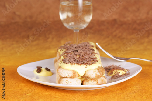 Tiramisù cake served on a white plate