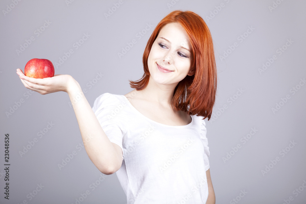Girl with red apple in hand Girl with red apple in hand