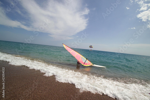an image of a man windsurfing on summer time