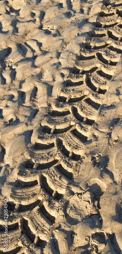 Tyre track in wet sand