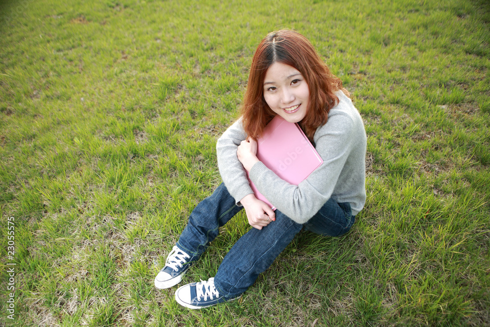 asina reading book on grass