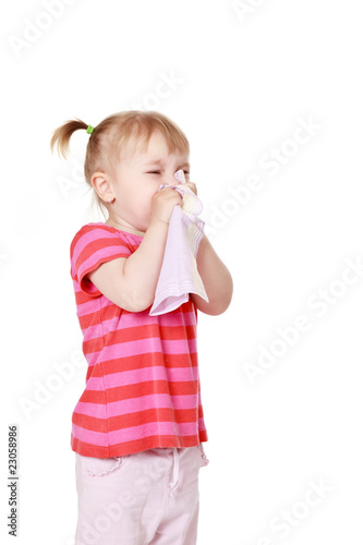 girl is blowing her nose
