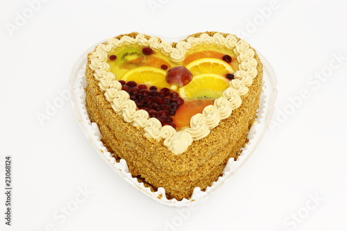 Pie biscuit with a cream decorated with fresh fruit