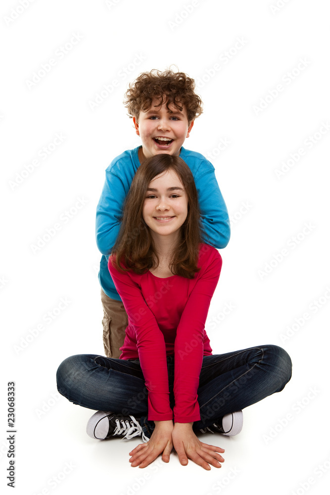 Girl and boy sitting on white background Girl and boy sitting on white background