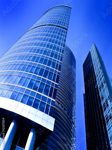 facade of modern building with reflection of blue sky