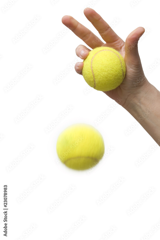 hand and tennis balls