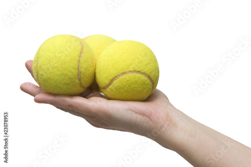 hand and tennis balls © Ambrophoto