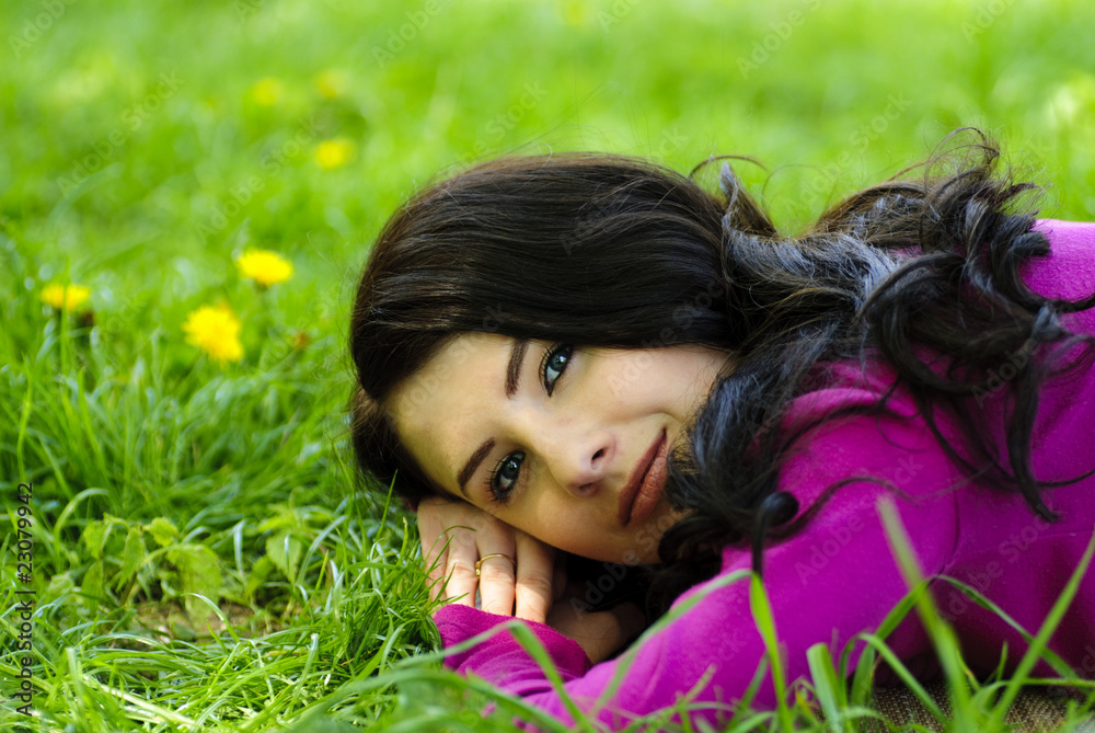 Girl take pleasure on the grass with dandelions Girl take pleasure on the grass with dandelions