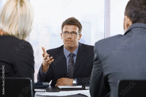 Businessman talking at meeting