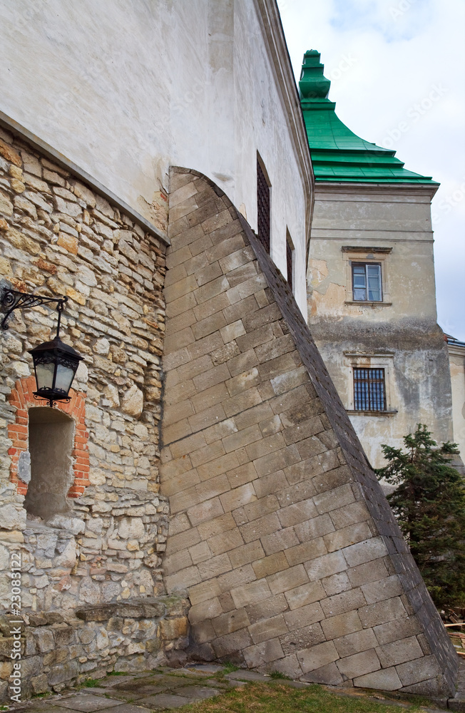 Stony wall with window and lamp (Olesko Castle, Ukraine)