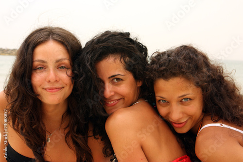 three girlfriends on the beach
