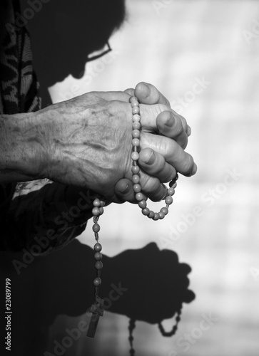 hands of old woman by prayer © Renáta Sedmáková