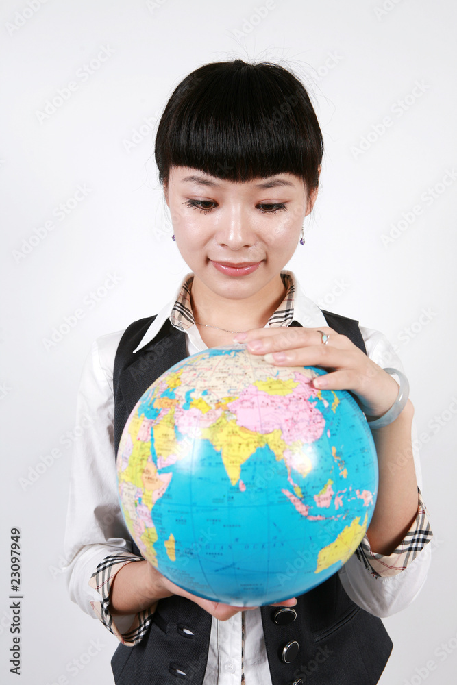 businesswoman holding a globe on white background businesswoman holding a globe on white background