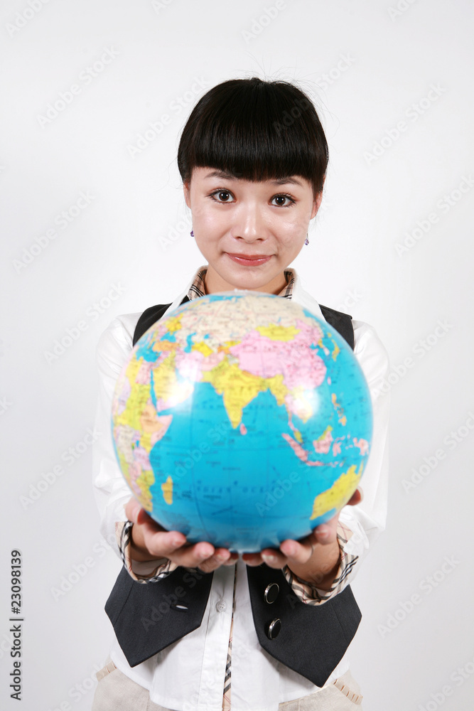 businesswoman holding a globe on white background businesswoman holding a globe on white background