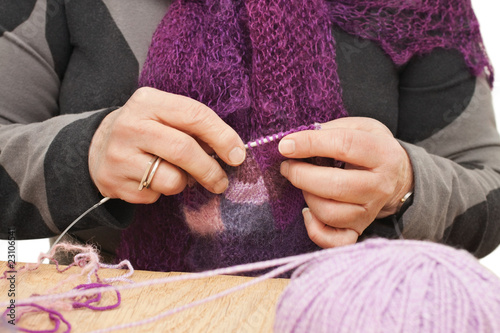 Old womans hands knitting with wool
