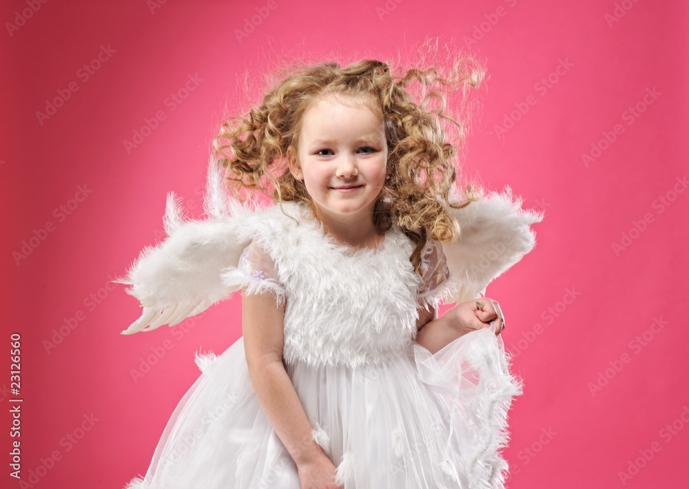Beautiful little angel girl isolated on pink background Beautiful little angel girl isolated on pink background