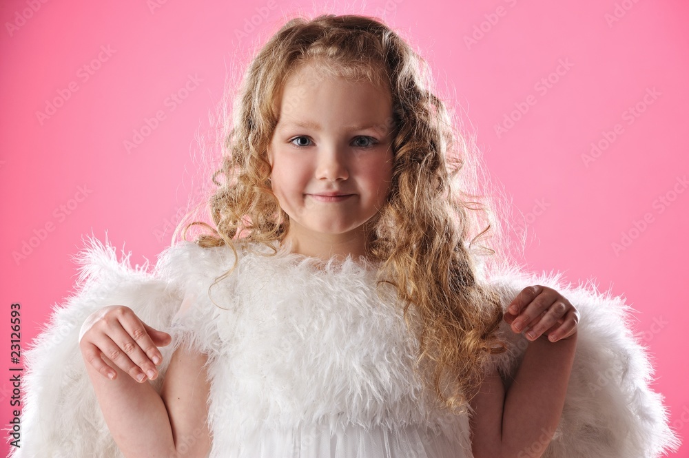 Beautiful little angel girl isolated on pink background Beautiful little angel girl isolated on pink background