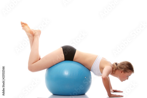 Woman exercising with fitness ball