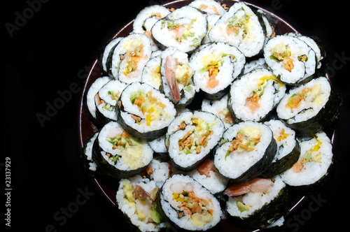 Sushi plate black background