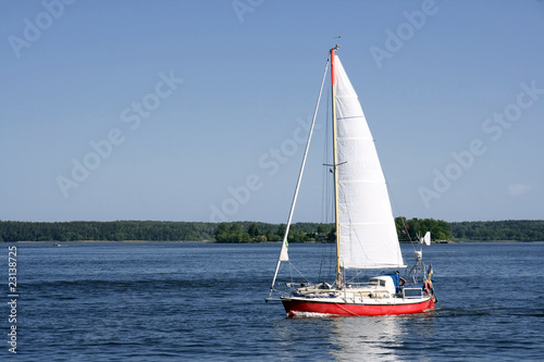 Sailing boat in blueand calm sea