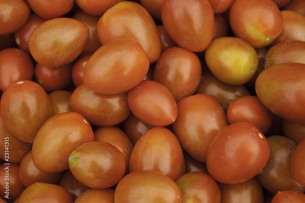A background of ripe red tomatos A background of ripe red tomatos