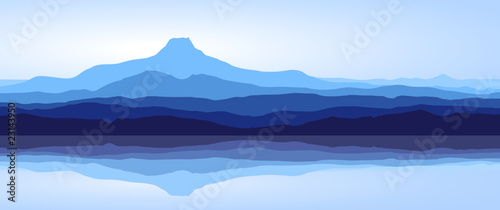 View of blue mountains with reflection in lake - panorama