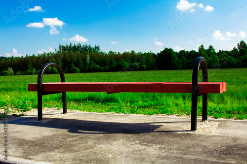 Red bench on the nature