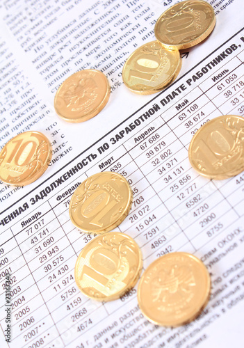 Ten rouble coins on the newspaper