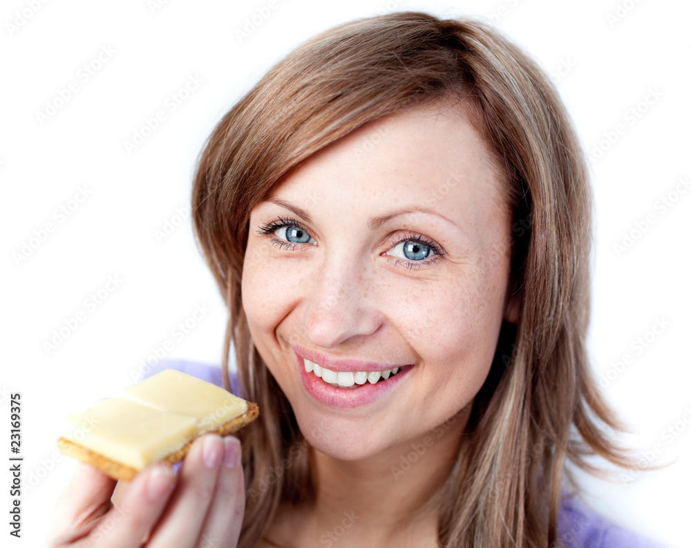 Beautiful woman eating a cracker with cheese Beautiful woman eating a cracker with cheese