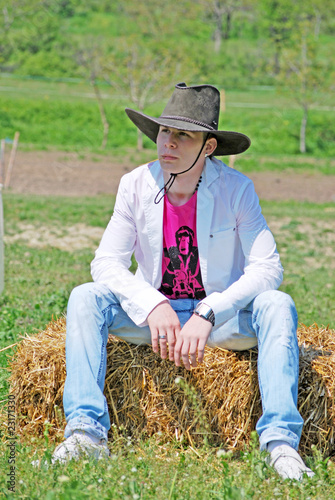 young man on hay bale