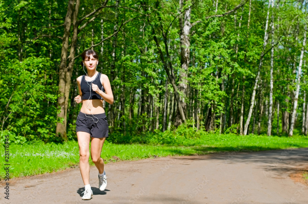 young woman running in park