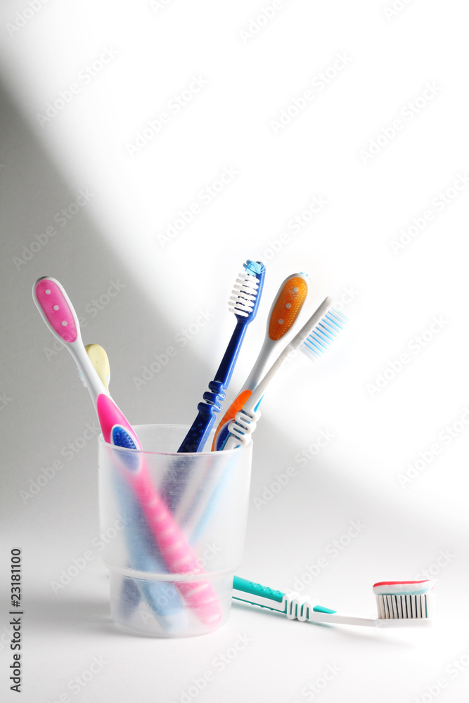 Toothbrushes in a glass Toothbrushes in a glass