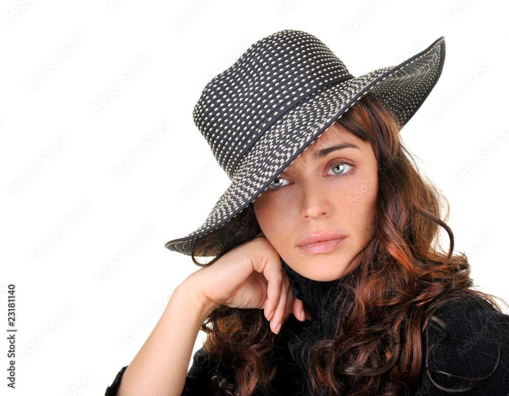 Gorgeous fashion model wearing a hat isolated on white. Gorgeous fashion model wearing a hat isolated on white.
