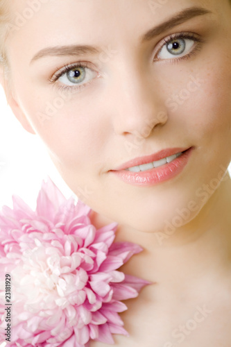 beautiful woman with flower closeup on white background