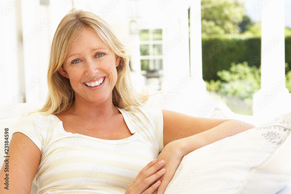 Portrait Of Young Woman Relaxing On Sofa Portrait Of Young Woman Relaxing On Sofa