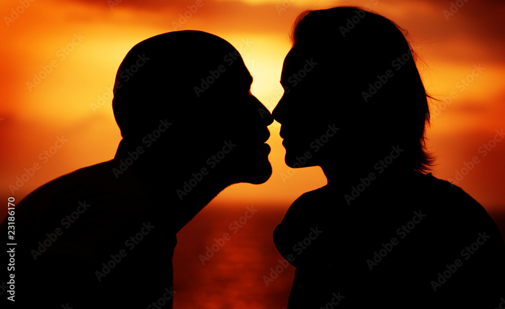 Couple over sunset background