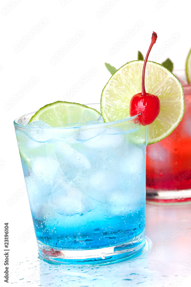 Two cocktails with lime slice and maraschino Two cocktails with lime slice and maraschino