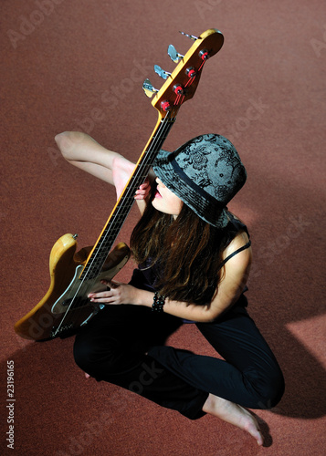 young pretty woman with guitare