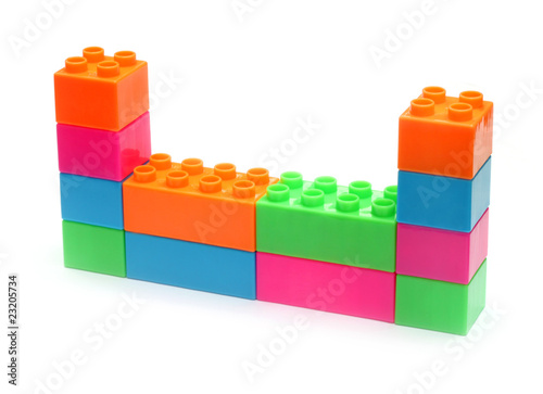 Colorful plastic toy bricks make wall