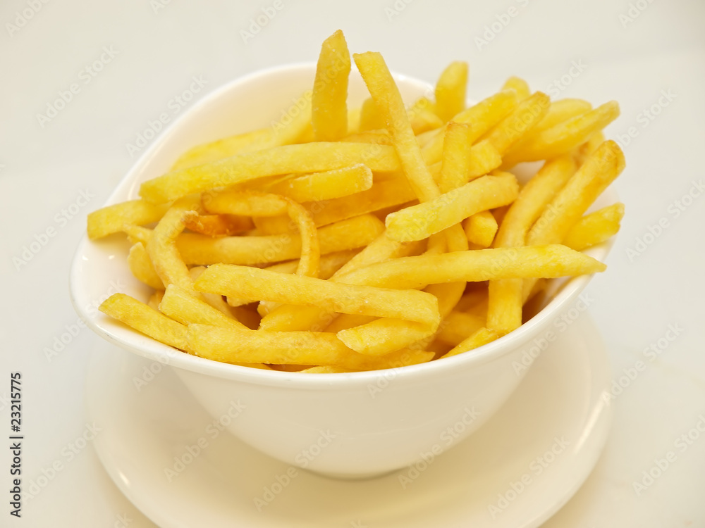 french fries in a white bowl french fries in a white bowl