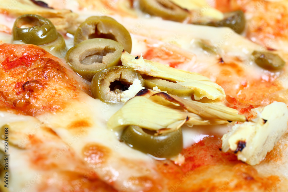 Fresh baked pizza with olives and artichokes Fresh baked pizza with olives and artichokes
