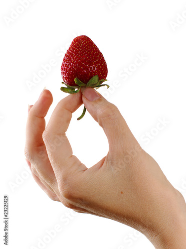 Single strawberry in woman hand