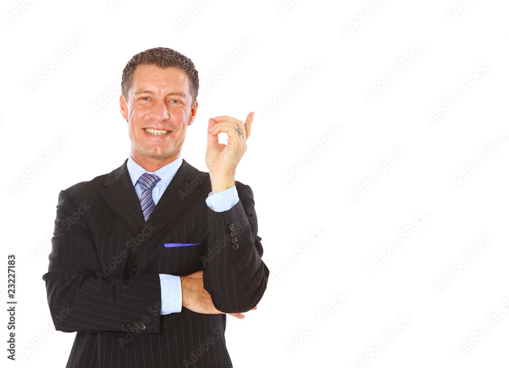 Attractive business man pointing at copy space Attractive business man pointing at copy space