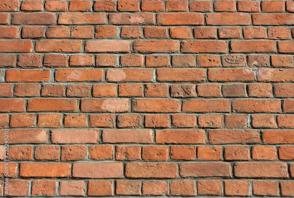 Century years old brick wall of Roman Catholic church